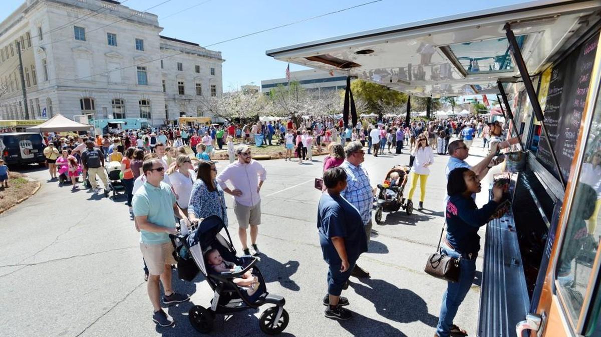Outside Tex's Tacos truck at the Mulberry Street Arts and Crafts Festival Saturday, a line stretched all the way across Third Street through the parkway where the demand for tacos was high.