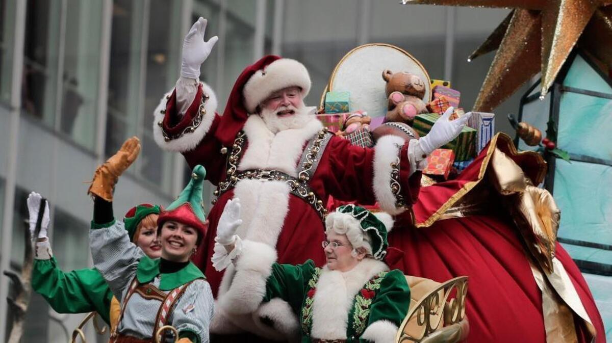 Santa Claus waves from his float as he passes along Sixth Avenue during the Macy’s Thanksgiving Day parade, Nov. 24, 2016, in New York.