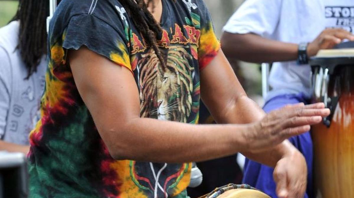 Dean Brown performs with a drum band during a previous year’s Juneteenth Festival at Tattnall Square Park.