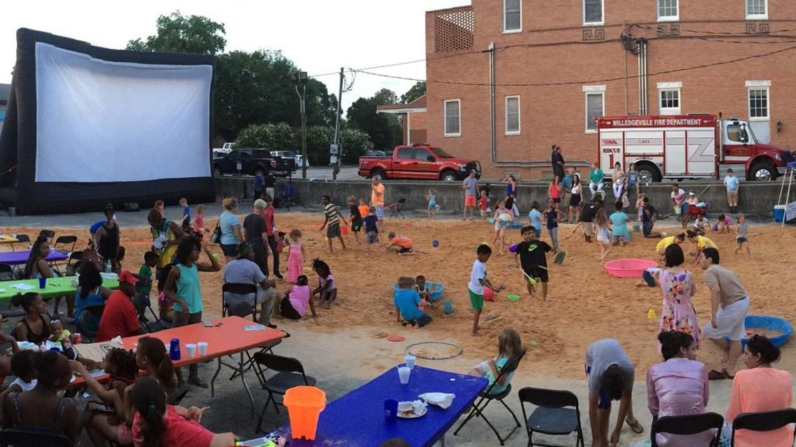 Milledgeville’s First Friday Beach Bash will include 80 tons of sand, beach toys, “Moana” on the big screen, snow cones for sale, popcorn, face painting, a dunk tank and more.