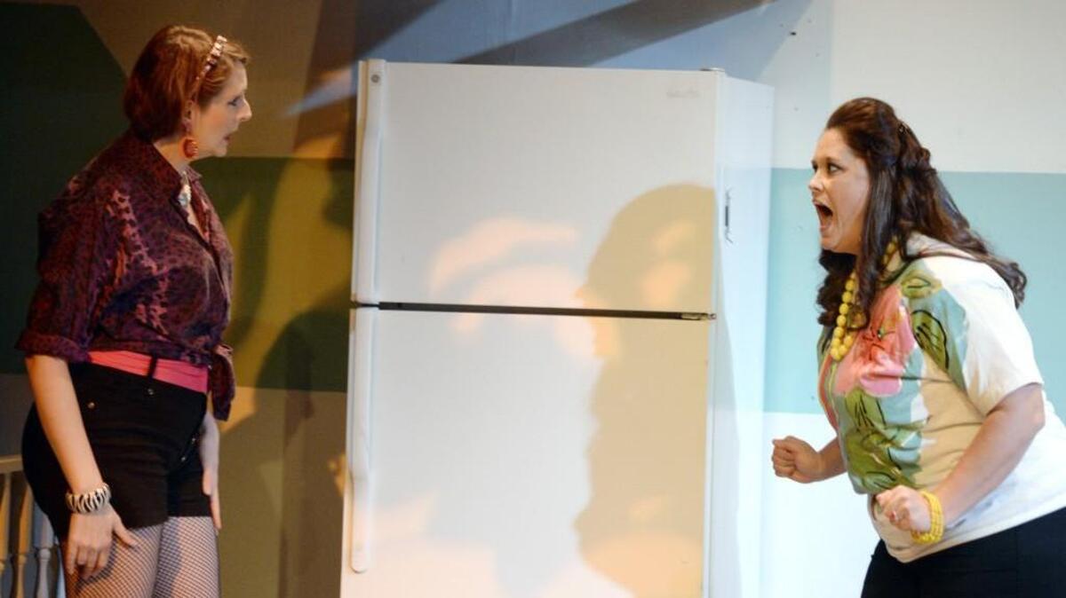 Georgia Olson, left, and Sabrina Dorrity rehearse a scene from Macon Little Theatre’s “Messiah on the Frigidaire.”
