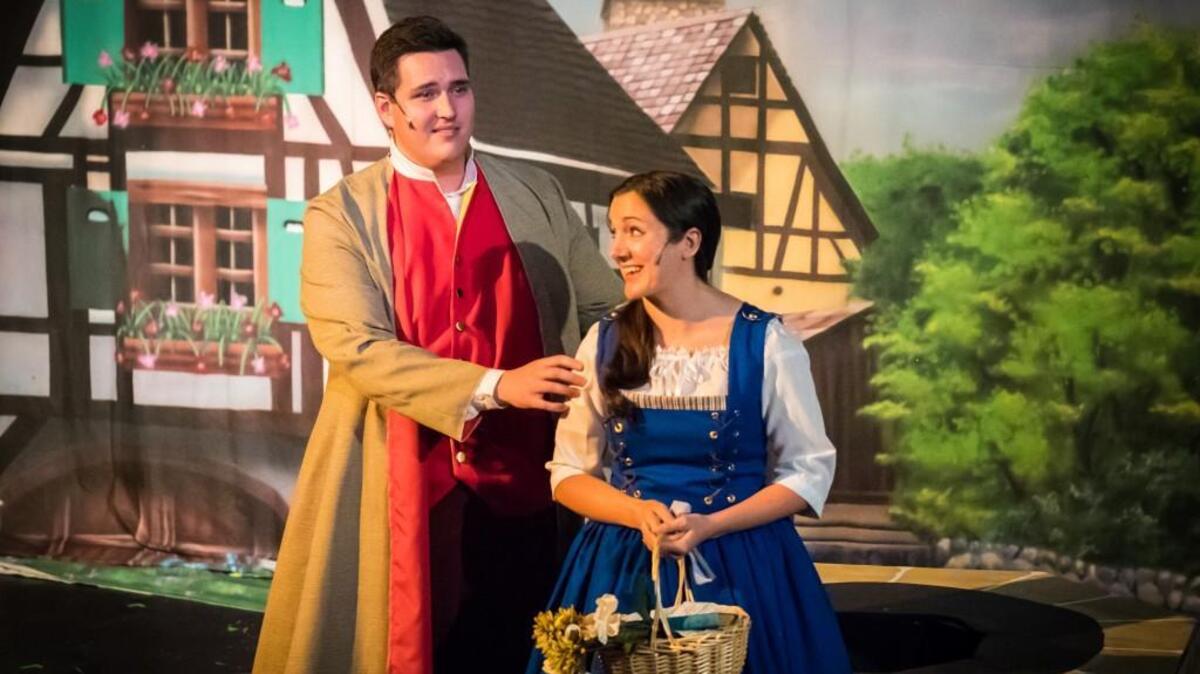 Jack Henson, left, as Gaston, and Kimberly Lochner, as Belle, are among the cast members in Theatre Macon’s production of “Disney’s Beauty and the Beast.”