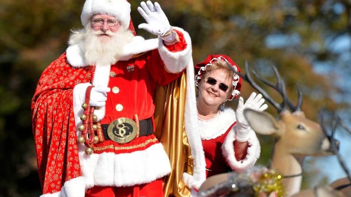 Santa and Mrs. Claus wave at onlookers along South Davis Drive in Warner Robins during the 2015 Robins Regional Christmas Parade. Watch the parade this year on Dec. 3.