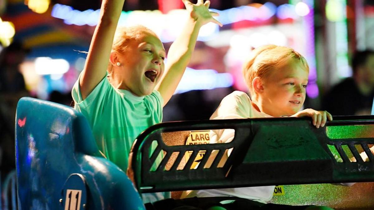 Madison Humber, 11, of McDonough, rides the Sizzler at the Georgia National Fair on Oct. 7. The fair continues to Oct. 15.