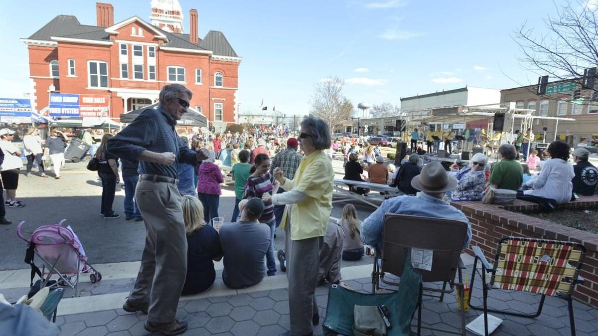 Folks dance to the music of the Good Time Band at a previous year’s Forsythia Festival.