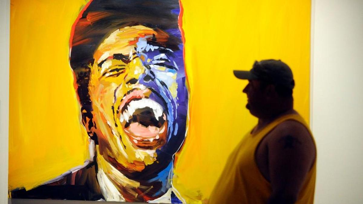 Chad Sutherland makes his way through the Pendley art exhibit at the Georgia Music Hall of Fame, which featured this tribute to Little Richard.