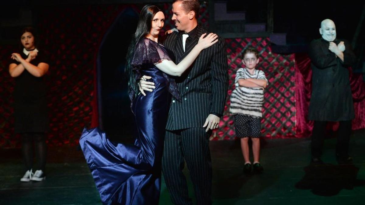 Wednesday (Kinsey DeGroat), Morticia (Georgia Olson), Gomez (Brian Olson), Pugsly (Carter Henley) and Fester (Jeffrey Lintz) in “The Addams Family” at Macon Little Theatre.