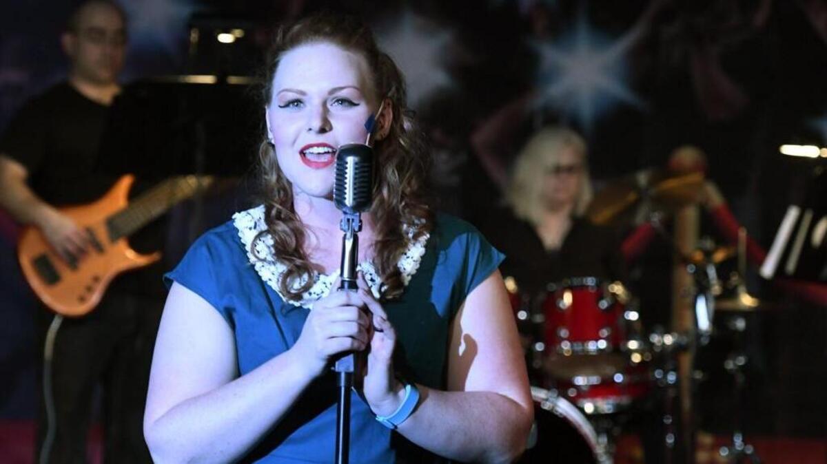 Jamey Figureoa sings in Macon Little Theatre’s production of “Blame it on the Movies.”