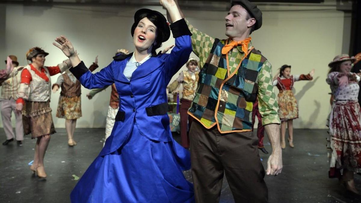 Holly Goodman, playing the title role in Perry Players’ production of “Mary Poppins,” sings and dances with Jason Niederkorn, who plays Bert.
