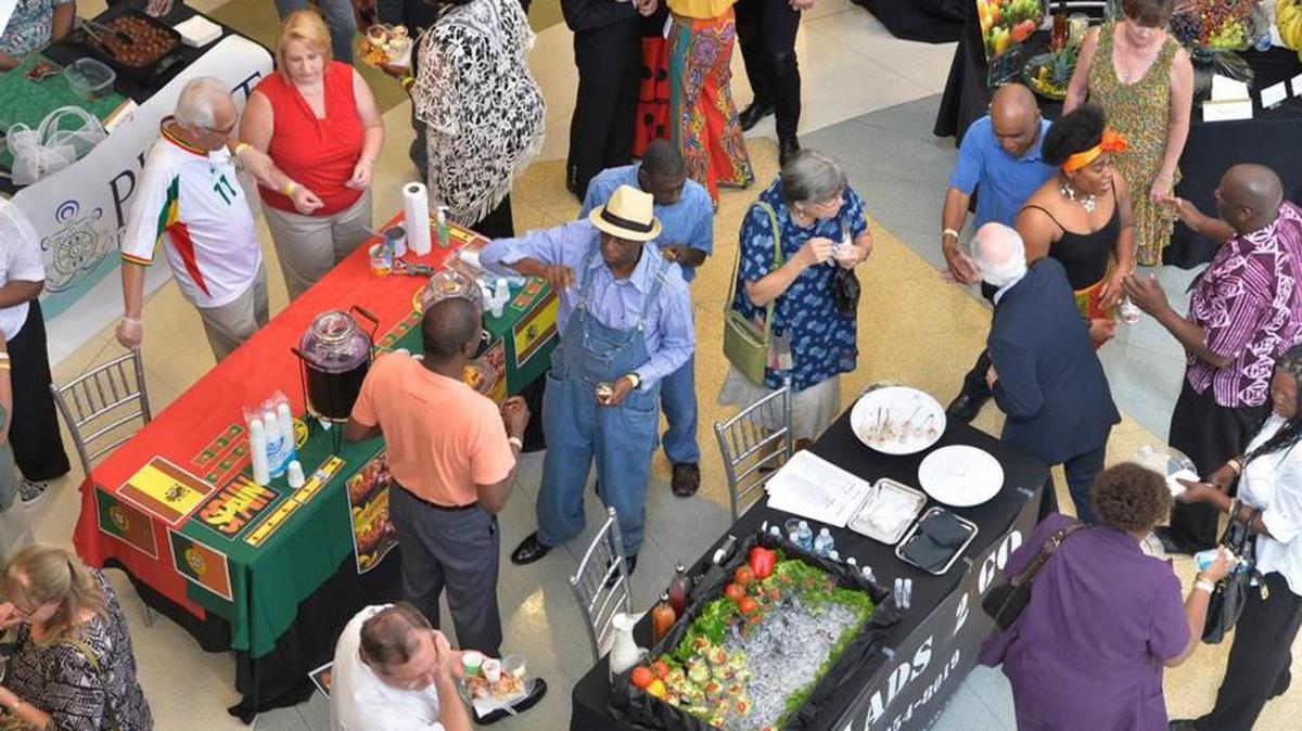 People try food from different countries and cultures at a previous year’s International Taste of Soul fundraiser for the Tubman Museum.