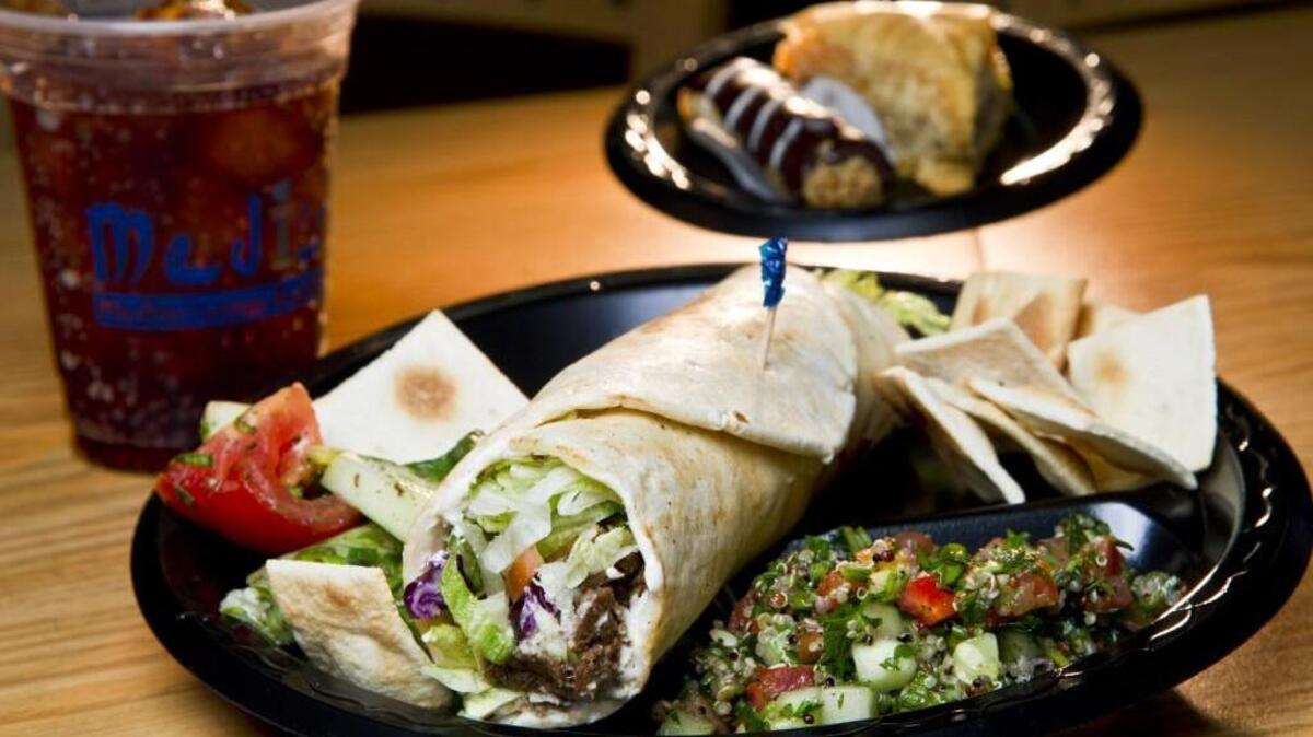 A beef and lamb shawarma wrap with tabbouleh and fatoosh salads are among the menu items at Medi’s Mediterannean Fusion.