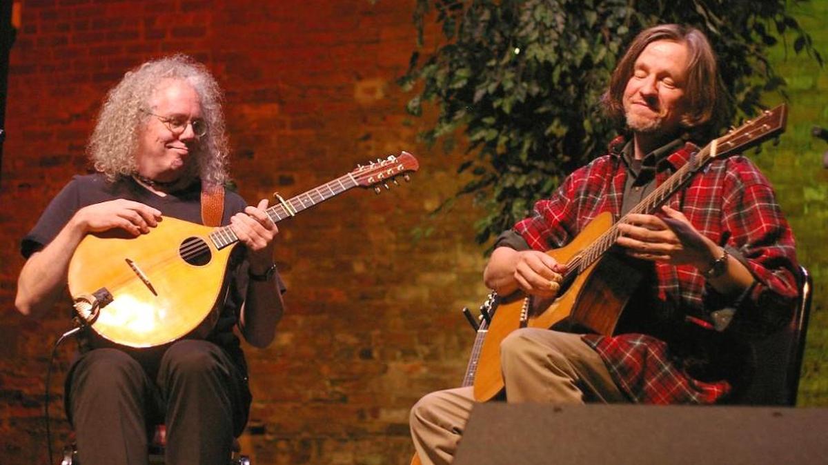 Cittern in hand, Robin Bullock, left, takes in a portion of Christmas music performed by Steve Baughman on guitar during a past year’s “Celtic Christmas.” The acclaimed duo will play Dec. 9 at Wesleyan College’s Pierce Chapel.