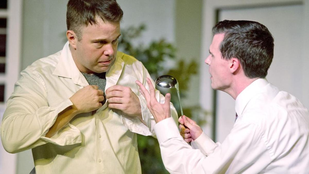 From left, Scot Cooley as Oscar and Tyler Bryant as Felix perform a scene from Macon Little Theatre’s production of “The Odd Couple.”