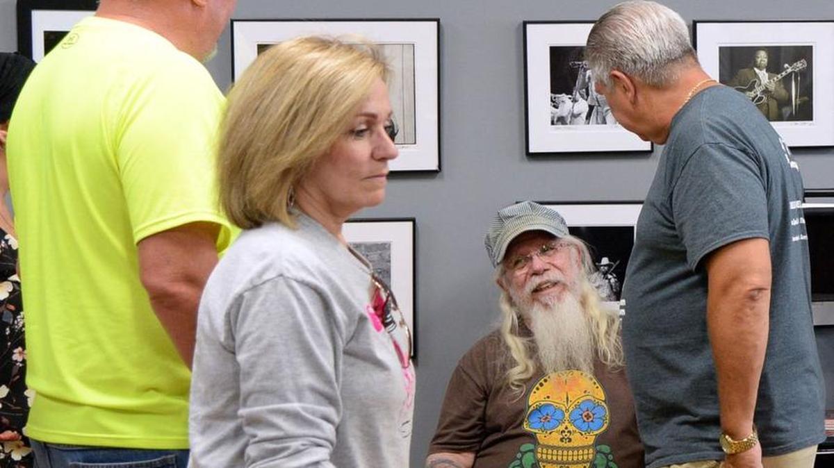 Kirk West, seated, will be among the authors signing books Dec. 1 at Gallery West in Macon.