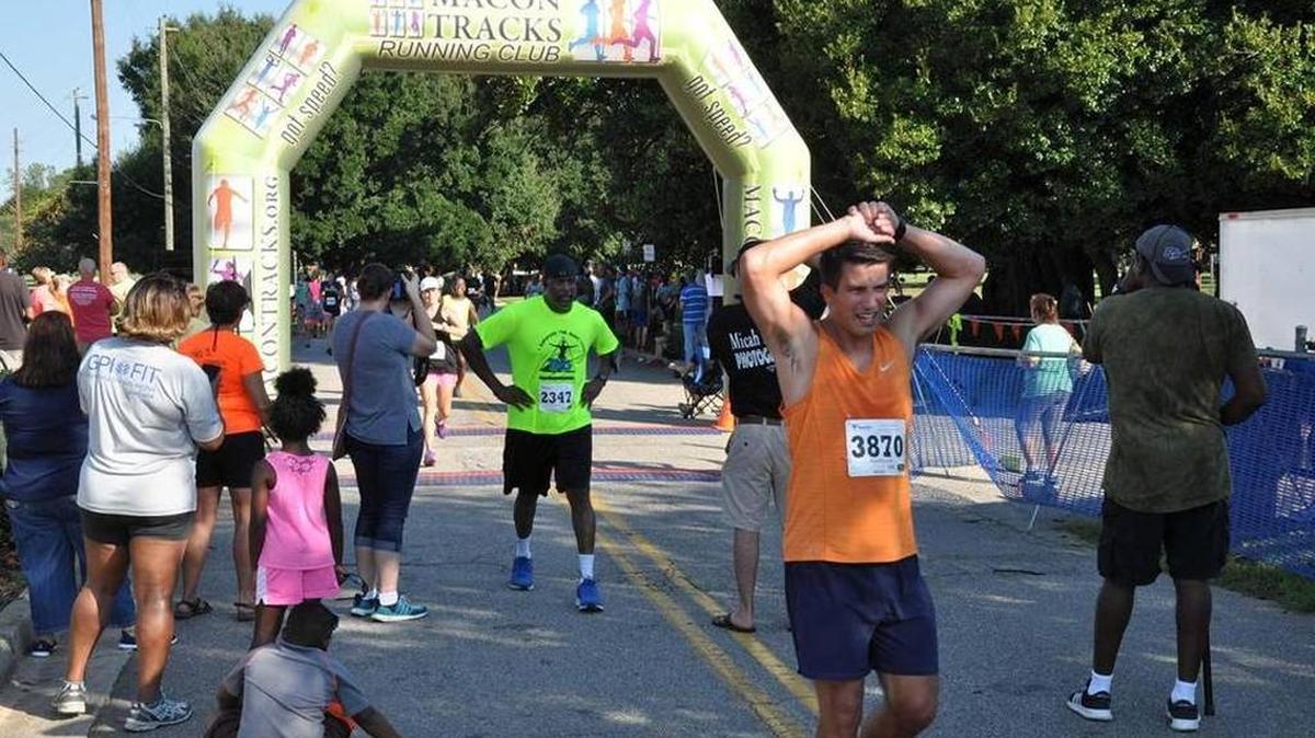 Runners cross the finish line at the 2016 Macon Labor Day Road Race.