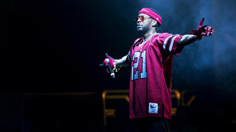 Music fans rock out at a soggy Music Midtown