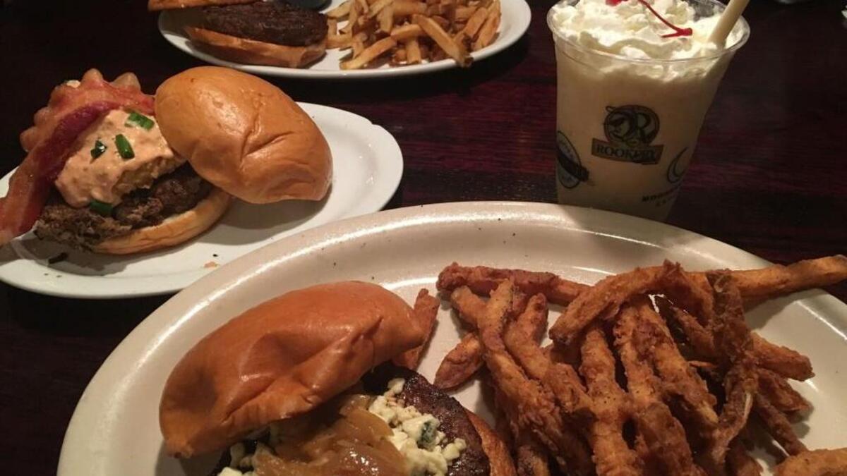 Among the options at the Rookery are, clockwise from bottom, James Brown bruger with battered fries and a Cherry Street shake, the Walden Greenback burger and the Rookery Burger with hand-cut fries