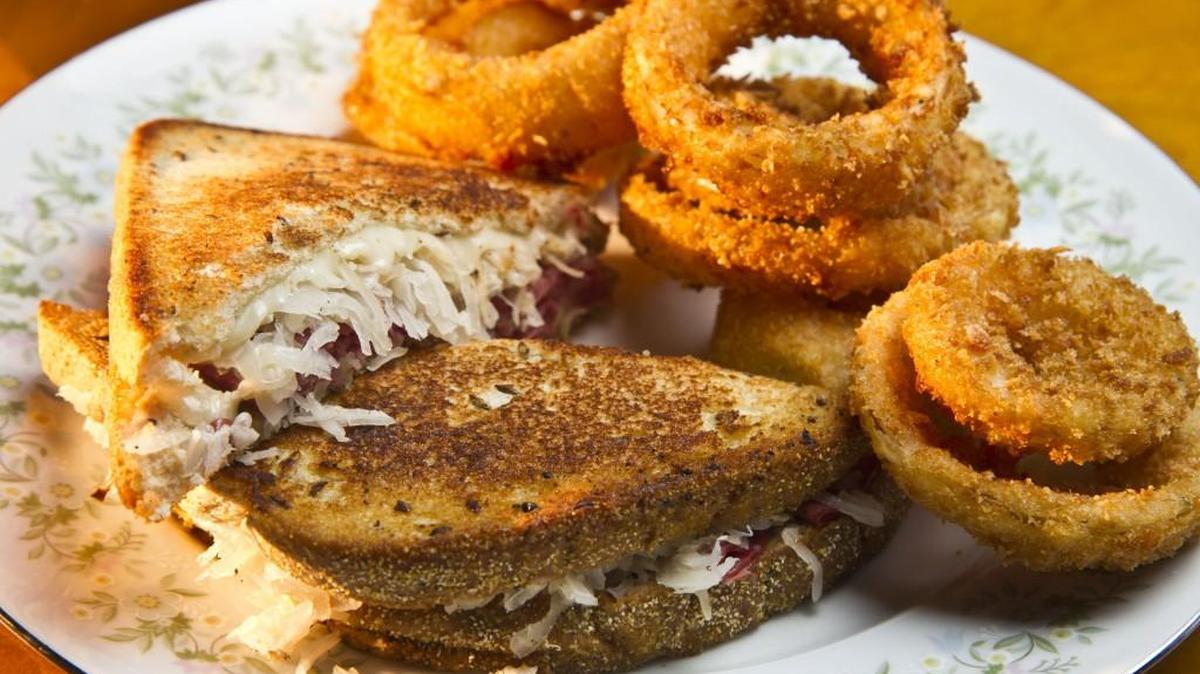 Menu options at Lanier’s in downtown Macon include the Epsilon Reuben sandwich and onion rings.