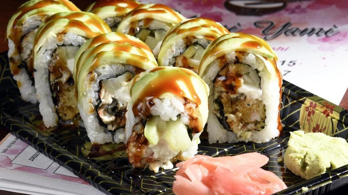 The Dragon Roll at Yami Yami in Bonaire features fried shrimp, eel, cucumber and cream cheese inside, with sesame, avocado and eel sauce on top.