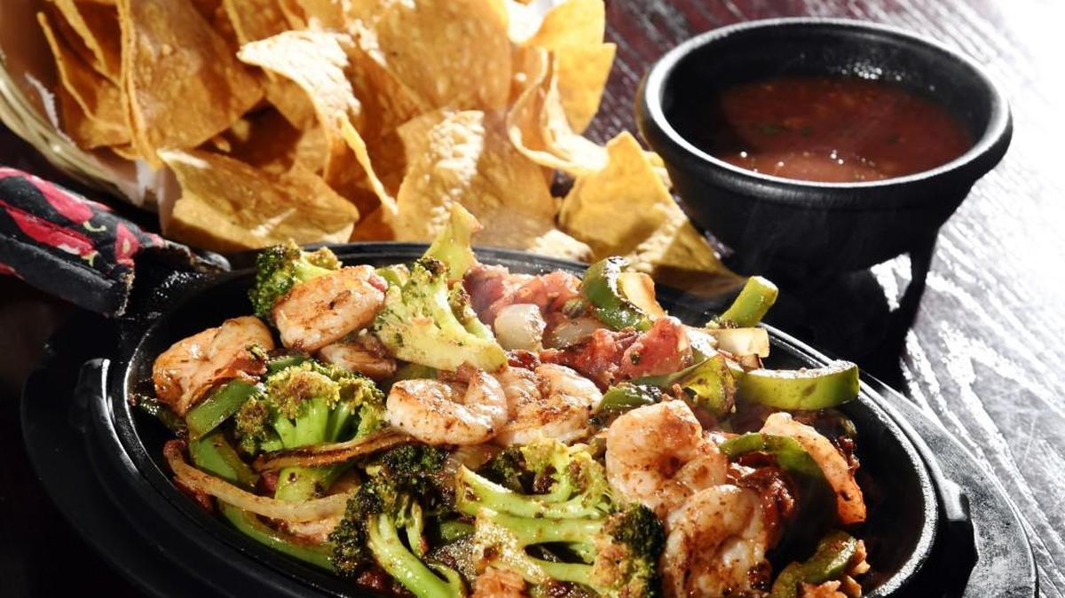 The Border Skillet from Tzango comes with grilled shrimp, bell peppers, caramelized onions, grilled tomatoes and broccoli over rice.