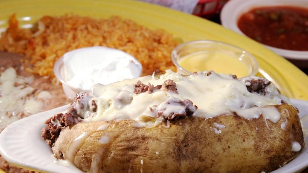Mrs. Judy’s Papa Rellena at Agave Azul in Gray features a baked potato stuffed with steak, chicken, shrimp or a mix of all three and is served with beans and rice.