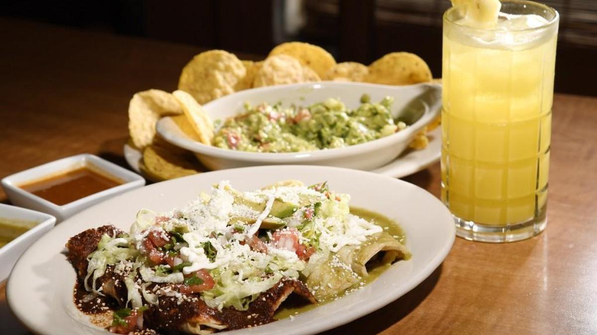 Enchiladas from La Bella Morelia with guacamole and aguas frescas.