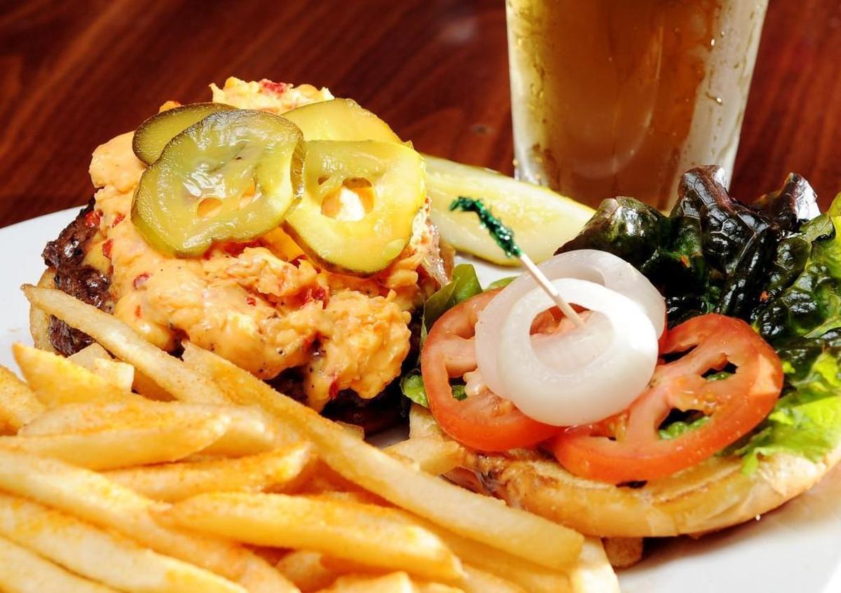 One of the burgers at The Rookery in Macon named from musicians is the Johnny Jenkins burger, a hamburger cooked to order topped with pimento cheese, bread and butter pickles, onion and lettuce.