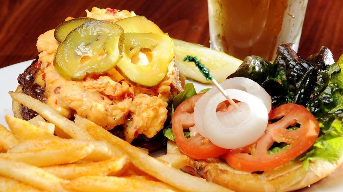 One of the burgers at The Rookery in Macon named from musicians is the Johnny Jenkins burger, a hamburger cooked to order topped with pimento cheese, bread and butter pickles, onion and lettuce.