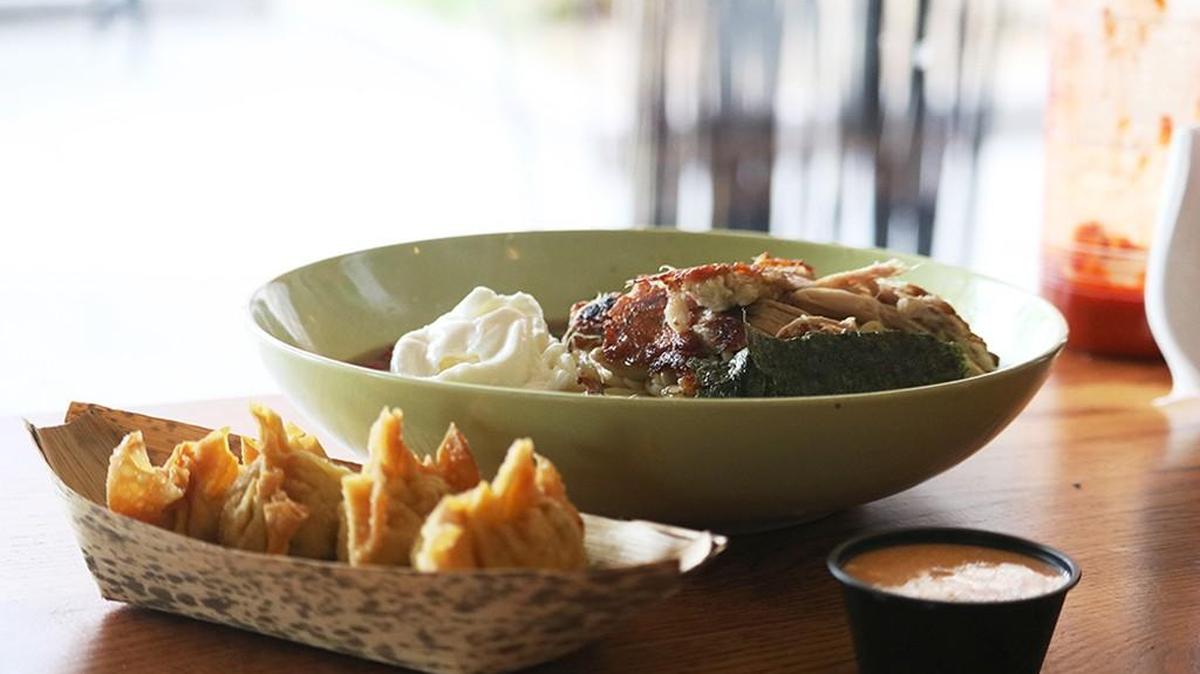 A ramen bowl and crab rangoon fried dumplings are among the dishes available at Ginger Stir Fry and Grill. The ramen bowl consists of pork belly, scallions, radishes, nori, candied shiitake and a soft poached egg.