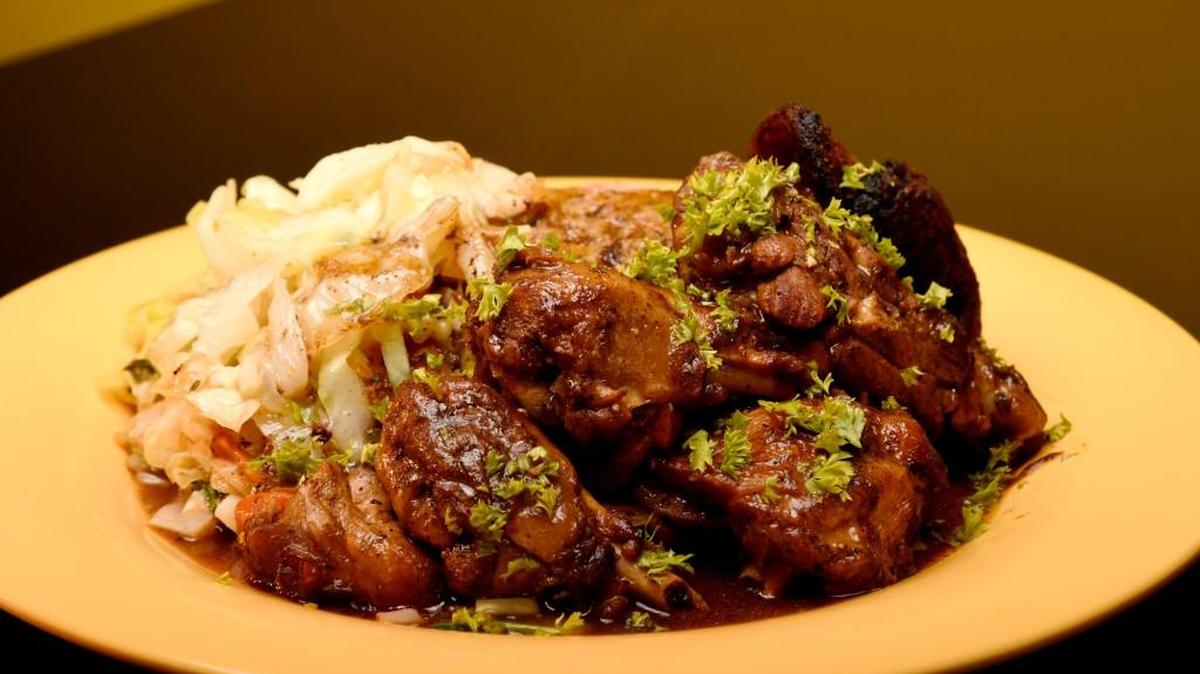Brown stew chicken with steamed cabbage and rice from Kirk’s Jerk Kitchen in Milledgeville from when it was in operation in Milledgeville.