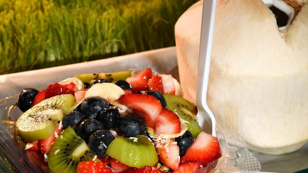 The acai super bowl at Harp and Bowl comes with a coconut water on the side.