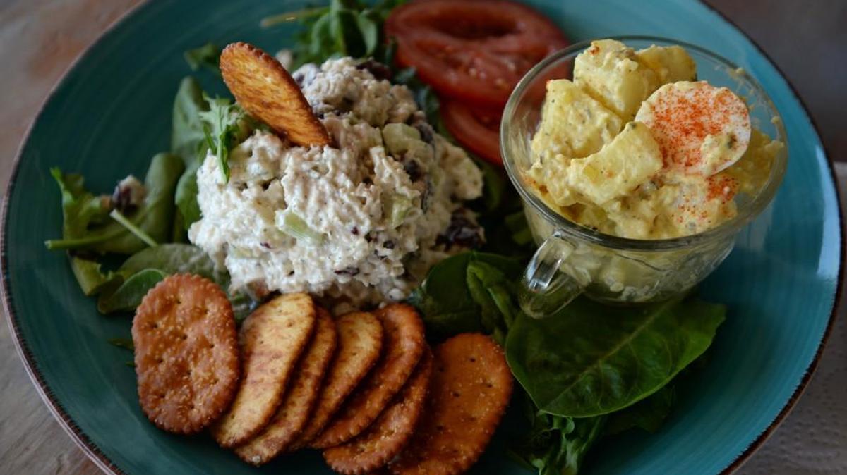 Molly’s Cafe on Vineville Avenue serves its classic chicken salad on a bed of salad greens with a side of potato salad.