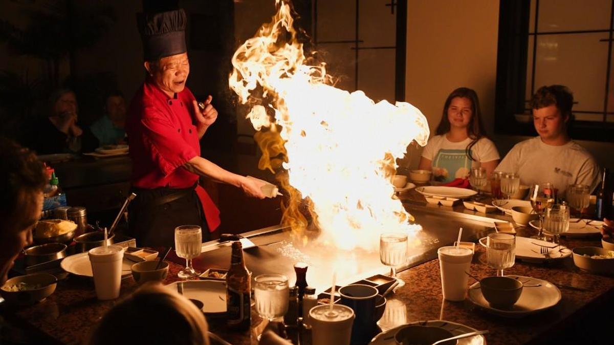 Chef Binh Psam puts on a show at the table-side hibachi grill at Mikata Japanese Steakhouse & Sushi Bar in Macon.