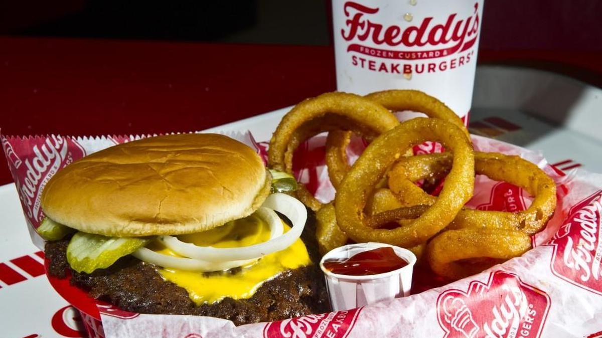 The Freddy’s original double cheese burger with onion rings and a drink from Freddy’s Frozen Custard and Steakburgers in Kathleen.