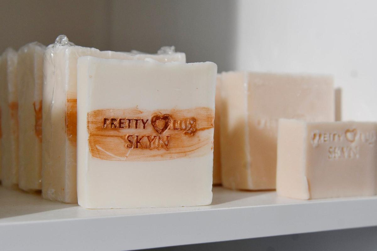A Skyn Bar from Pretty Luxe Co. sits on a shelf in Pretty Luxe Co. on Friday, May 31, 2024, in downtown Macon, Georgia. Pretty Luxe Co. offers candle making workshops and also sells organic home goods and skin care products.