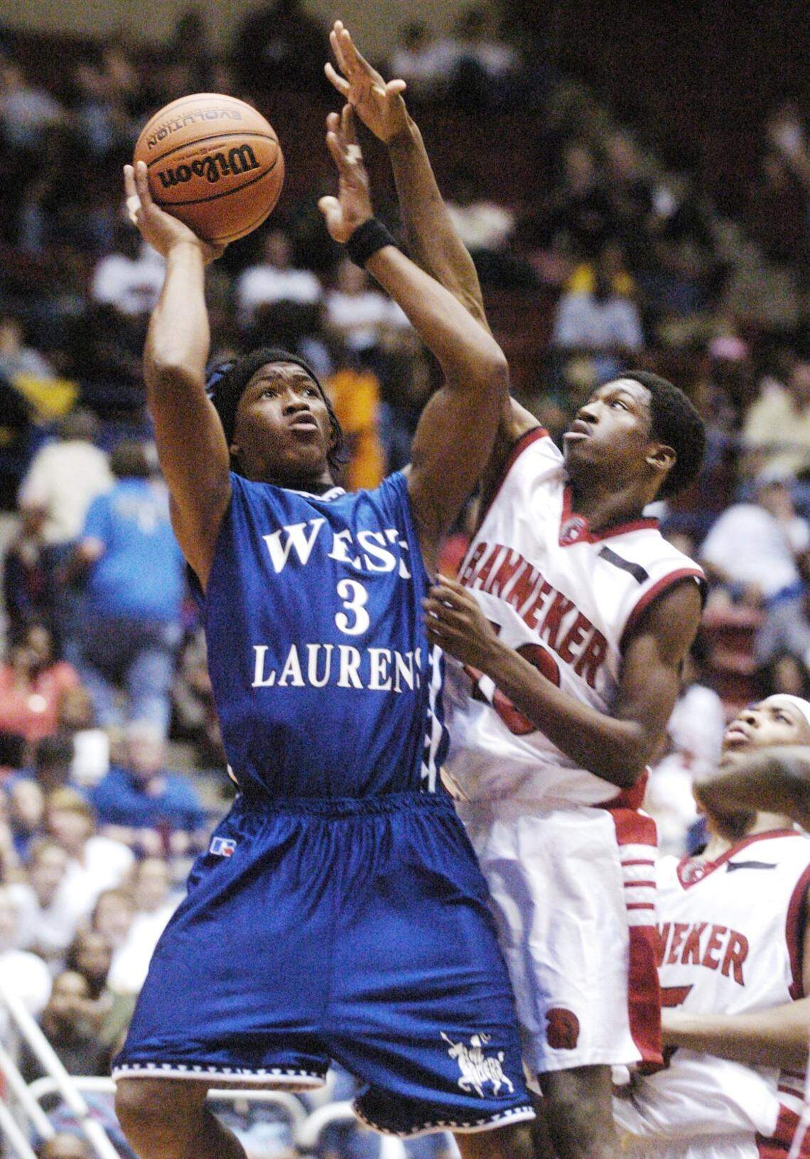 In this 2004 Telegraph file photo, West Laurens’ Demaryius Thomas draws a foul from Banneker’s Mychael Harris. Thomas would go on to play football for Georgia Tech and spend 10 seasons in the NFL with the Broncos, Texans and Jets. He died Thursday at age 33.