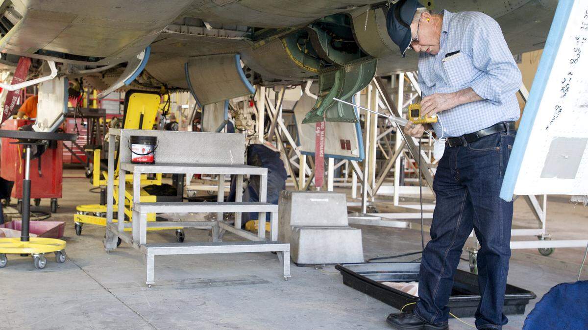 Aircraft mechanic Walter Riddle performs an atmospheric test on the fuel tank of an F-15 at Robins Air Force Base.