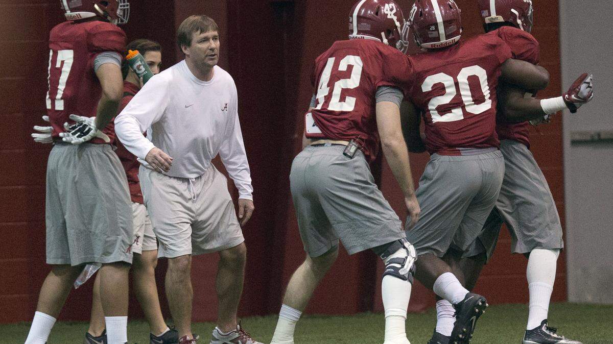 Alabama's defensive coach Kirby Smart runs drills with his players during football practice, Wednesday, Dec. 16, 2015, in Tuscaloosa, Ala. Kirby Smart has accepted the head coaching position at Georgia.