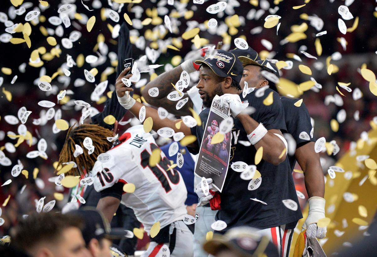 Georgia players celebrate the Bulldogs’ 33-18 win over Alabama in the College Football Playoff National Championship game Monday night.