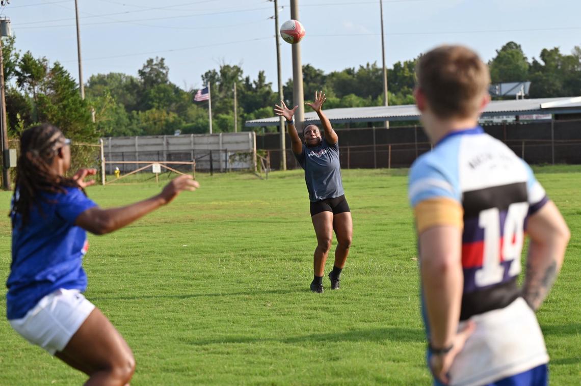 Brianna Cromartie goes to catch the ball during Macon Love Rugby practice on Thursday, Aug. 8, 2024, at Central City Park in Macon, Georgia. Macon’s amateur rugby team is expanding by competing with an all-female team at a summer competition this weekend.