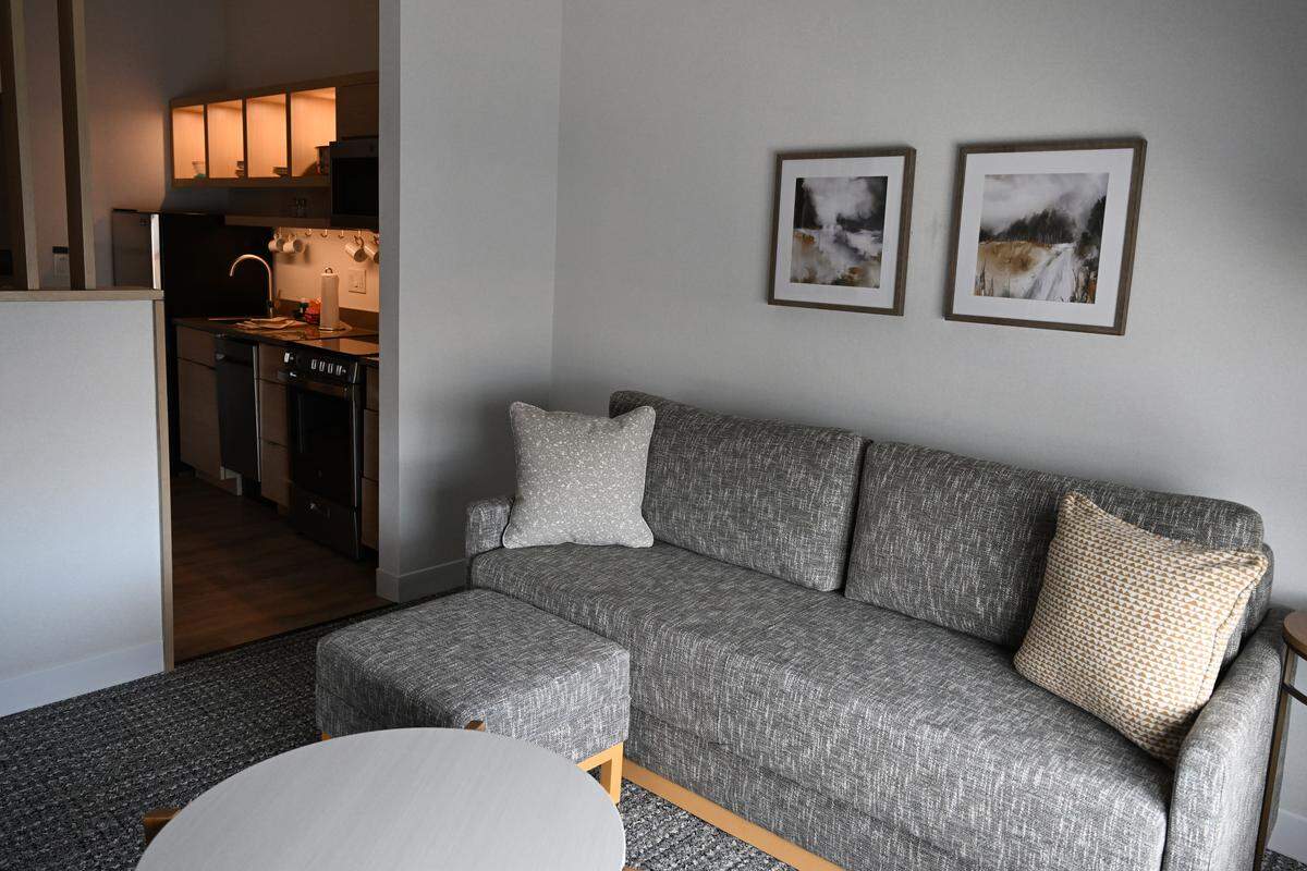 The king suite at the new TownPlace Suites by Marriott in Perry, Ga., includes a living room and kitchen. The hotel is one part of a dual-branded hotel at the Georgia National Fairgrounds & Agricenter. The suite also features a separate bedroom, and the couch folds out into a bed.