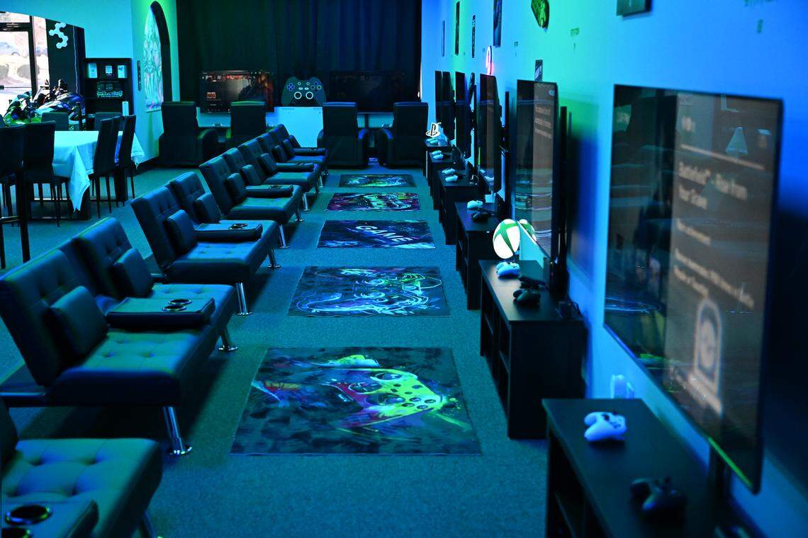 Televisions set up with gaming consoles and chairs line the walls of Disconnect Gaming Lounge in Warner Robins. The new business opening soon offers pay by the hour gaming caters to all ages.