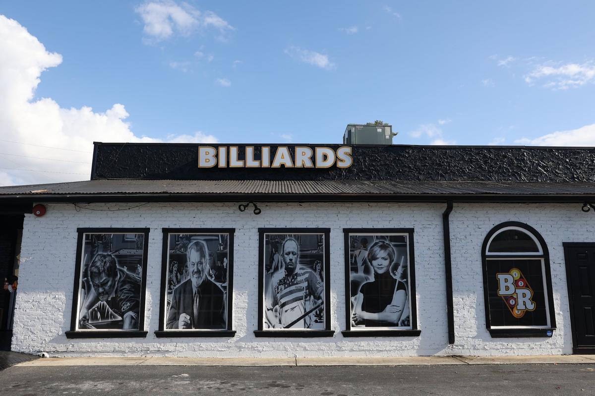 Top professional pool players line the outside windows of Brass Rack on Wednesday, Oct. 30, 2024, off of Riverside Drive in Macon, Georgia. Brass Rack opens on Friday, Nov. 1, and aims to create an atmosphere for all ages to gather.