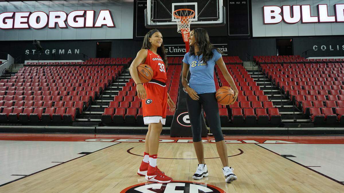 Mackenzie Engram and Maria Taylor hang out together inside Stegeman Coliseum.