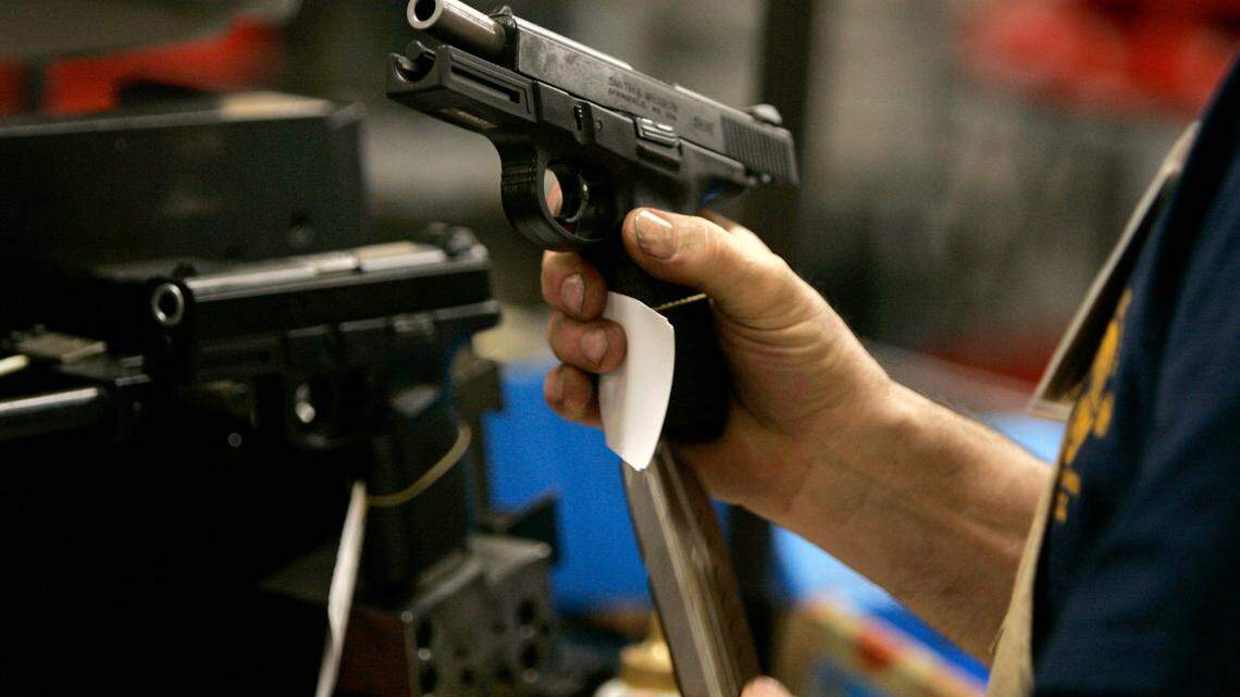 Only one gun was fired, but both the employee and owner were sent to the hospital, police say. The picture above was not taken at the Gun Lobby store. (AP Photo/Charles Krupa)