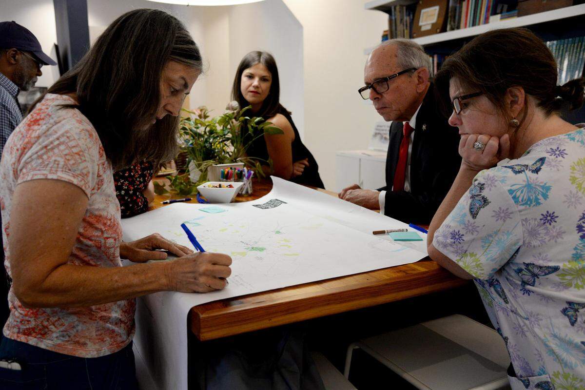 JENNA EASON/THE TELEGRAPH Macon, GA, 09/24/2019: Kathleen O’Neal, Susannah Maddux, Rabbi Larry Schlesinger and Chelsey Brown, left to right, discuss places in the Macon community that are significant at Historic Macon’s kickoff event for its Scenic Preservation Index on Tuesday.