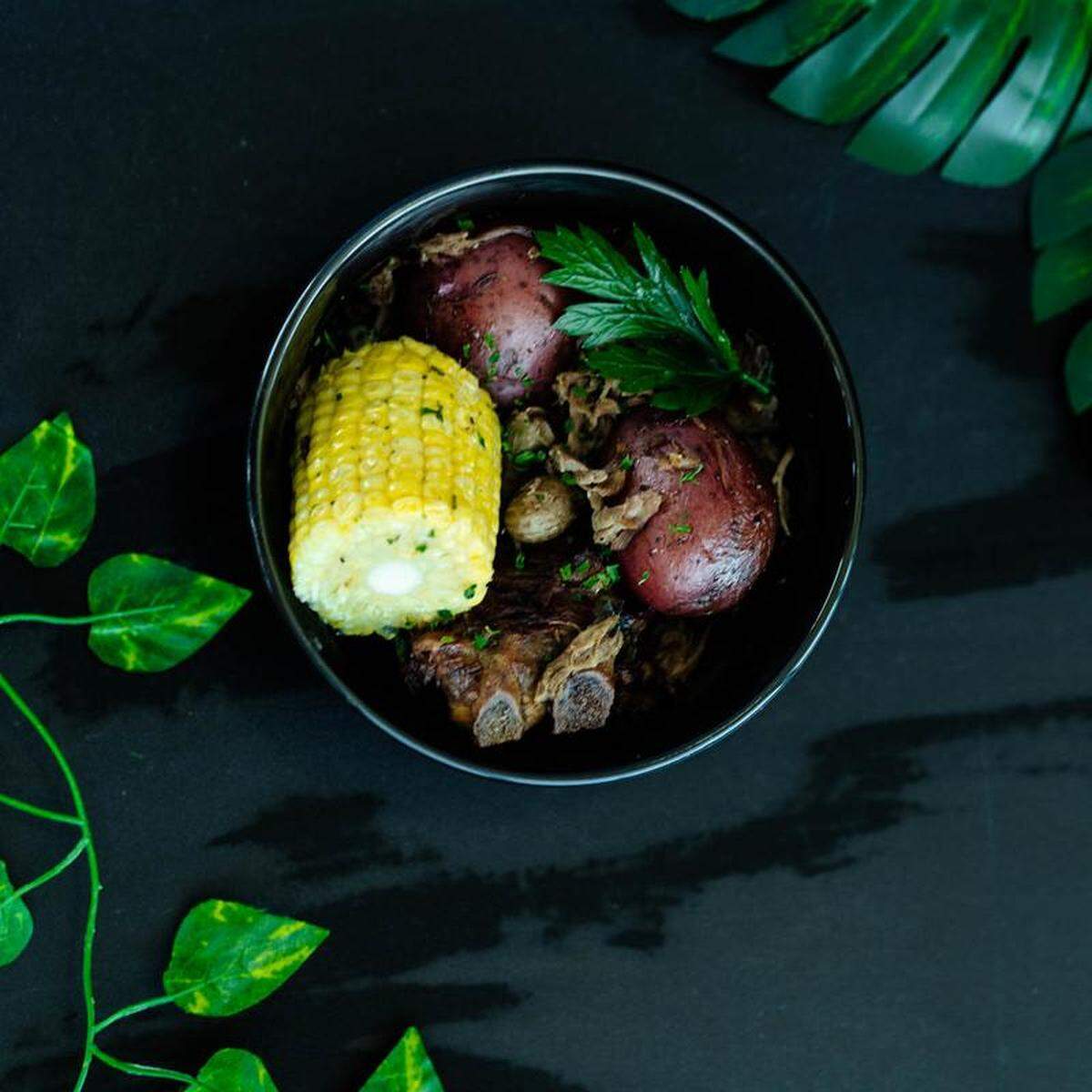 Miami peanut boil at Prominent Bar and Restaurant in Byron. The dish is described on the menu as neckbones and peanuts served with potatoes and corn on the cob.