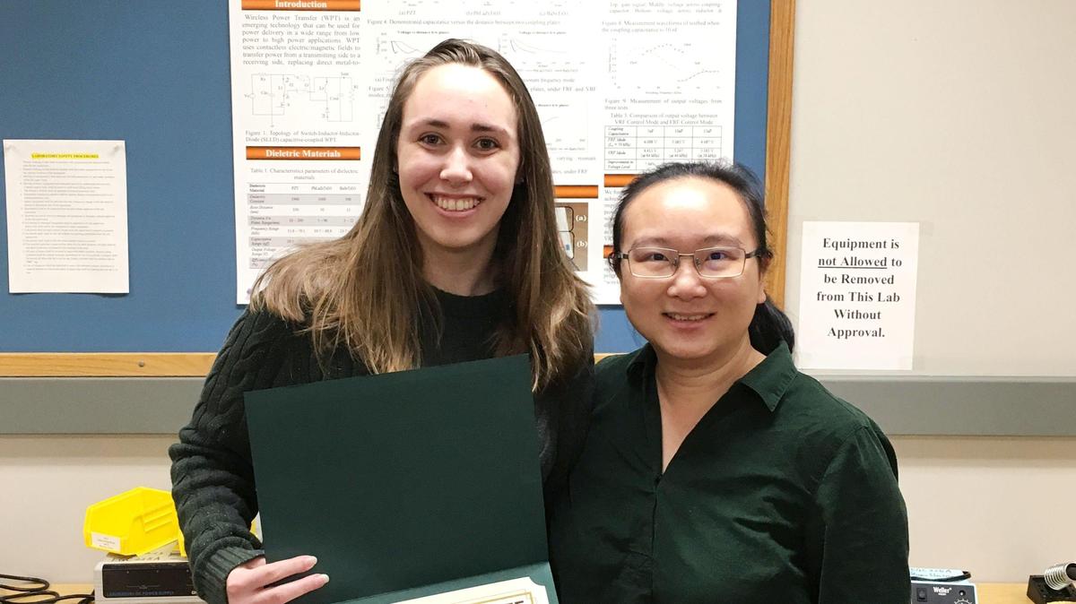 Caitlyn Patton, a recipient of the Institute of Electrical and Electronics Engineers (IEEE) Power and Energy Society (PES) Scholarship, stands with her professor Ruiyun Fu, an assistant professor of electrical and computer engineering, with whom she conducts research in wireless power transfer.