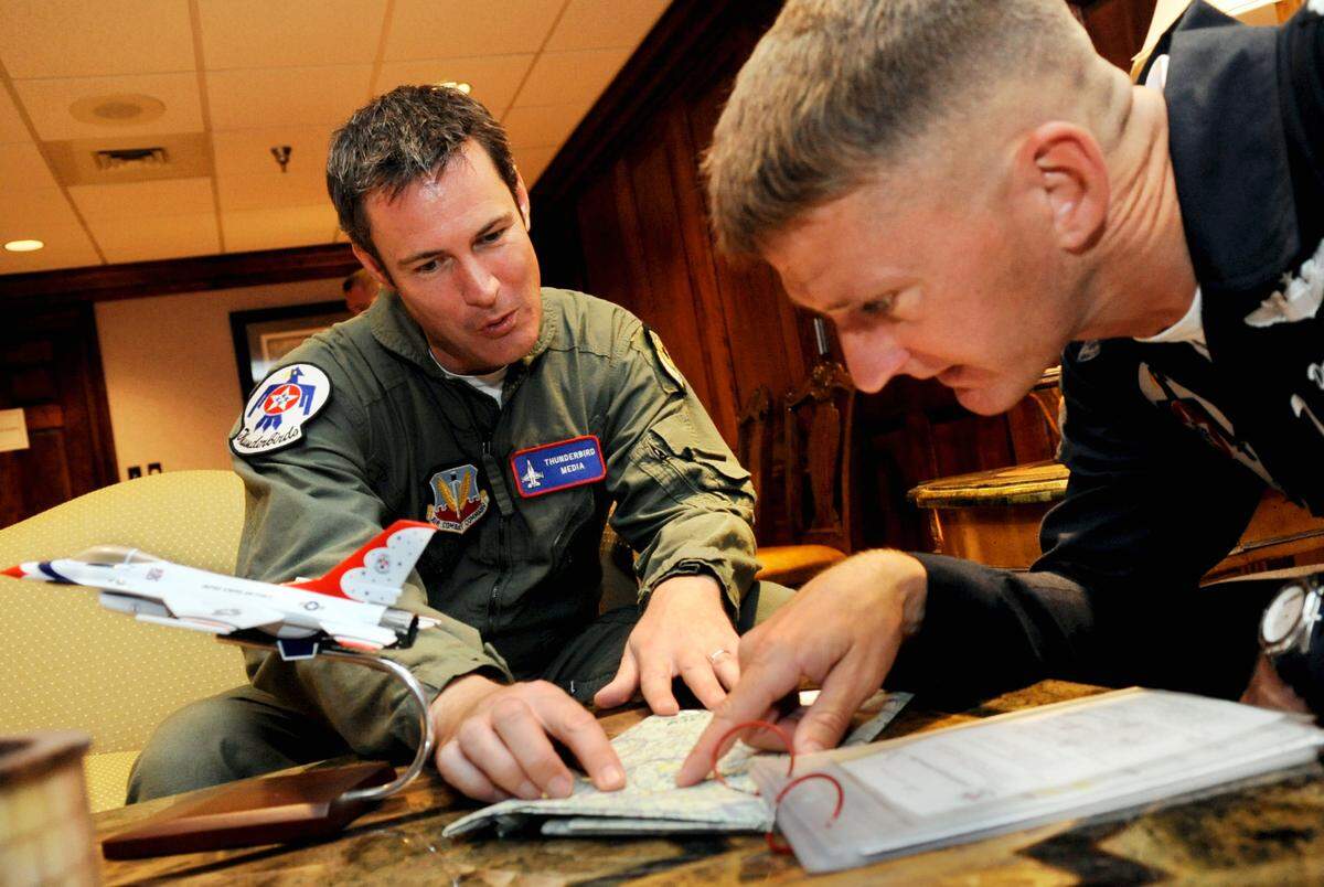 Lt. Col. Derek “Tazz” Routt with the U.S. Air Force Thunderbirds looks over a map with former Telegraph reporter Joe Kovac Jr. before their flight Thursday at Robins Air Force Base in this Telegraph file photo.