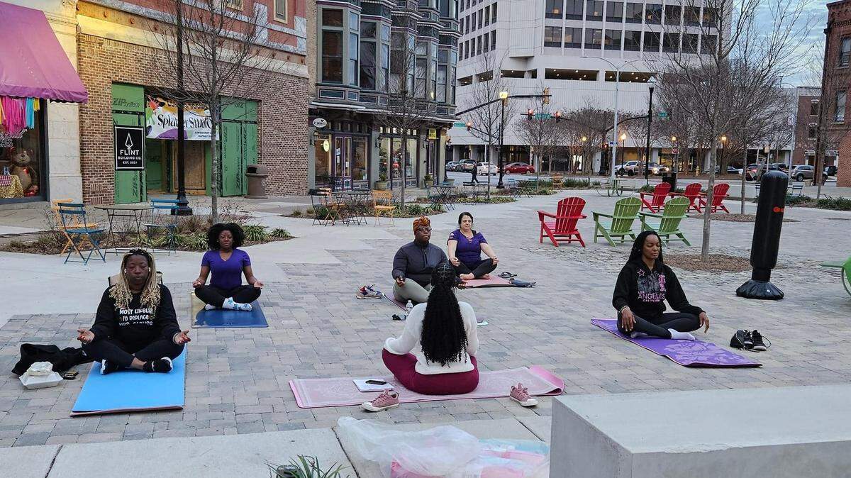 Andrea Cooke (far left), development director of Macon Mental Health Matters, joins in on the program’s Wellness Weekend event, which provides free access to mental health services in the community.
